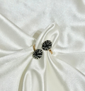 A double Opihi adjustable ring on a white background 