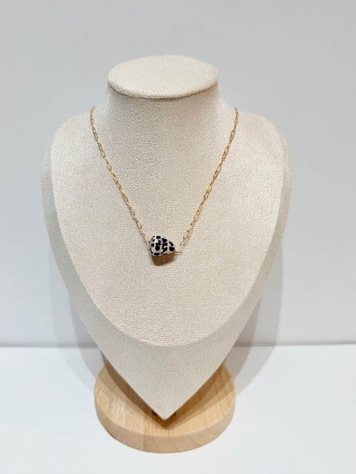 Hebrew cone shell floating necklace with spotted shell that slides freely on delicate gold chain