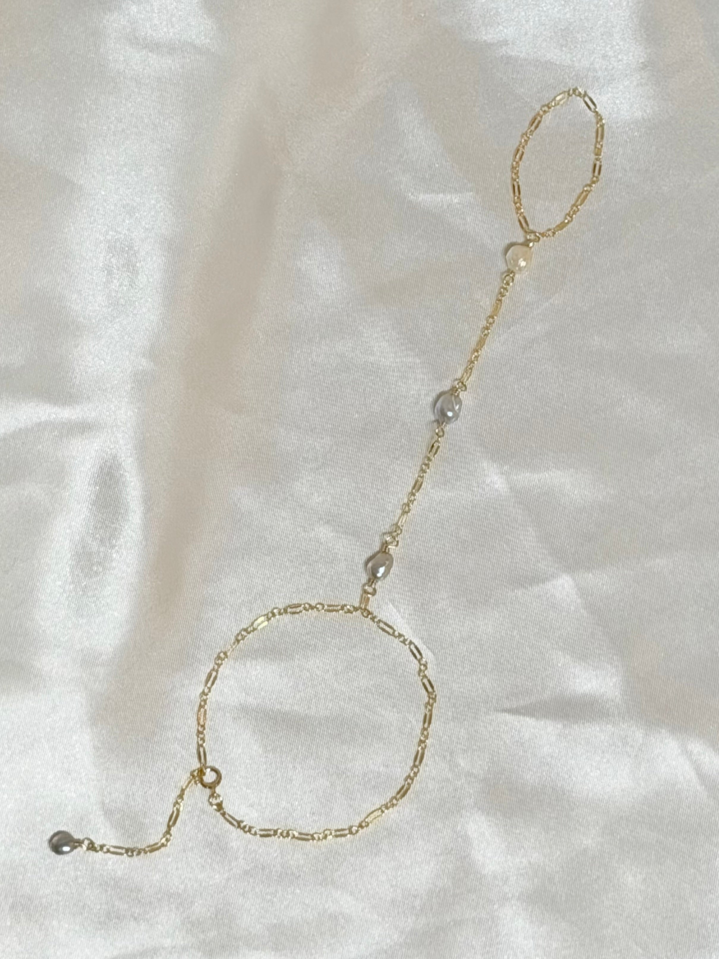 Ombré keshi pearl hand chain with white to gray pearls on 14k gold filled chain