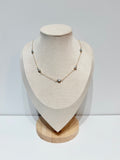 Lana keshi pearl necklace with five gray pearls evenly spaced along delicate gold chain