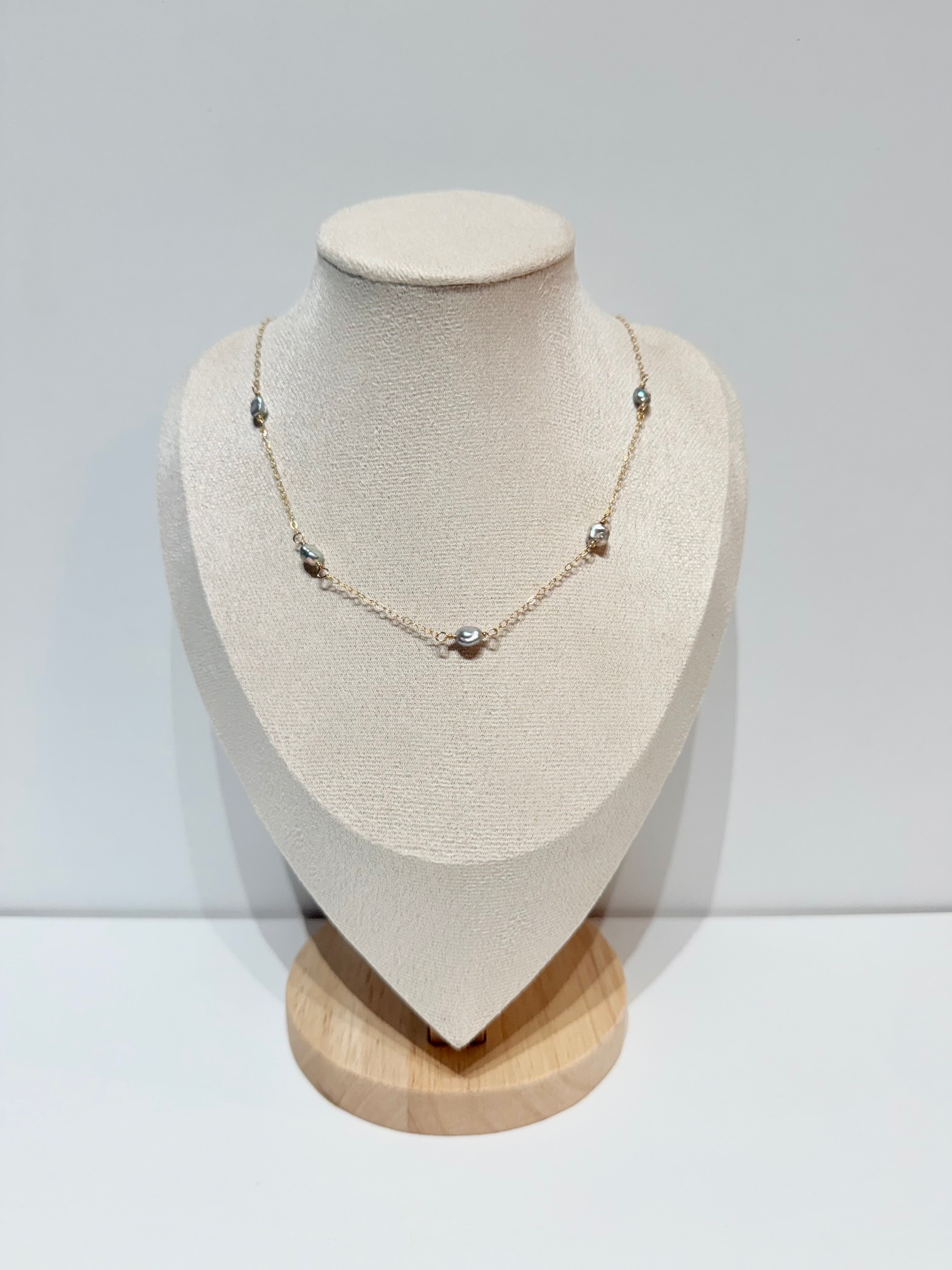 Lana keshi pearl necklace with five gray pearls evenly spaced along delicate gold chain