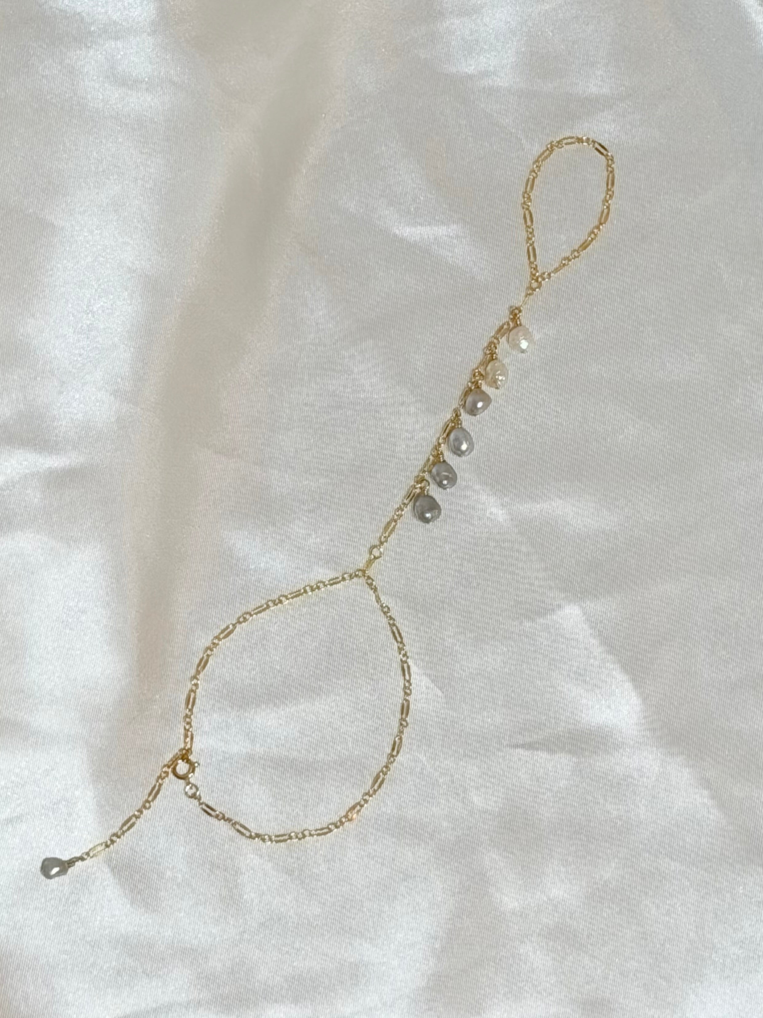 Ombré keshi pearl hand chain with white and gray pearls on 14k gold filled chain